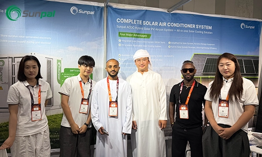 Sunpal team members and international partners posing together in front of the company exhibition booth.